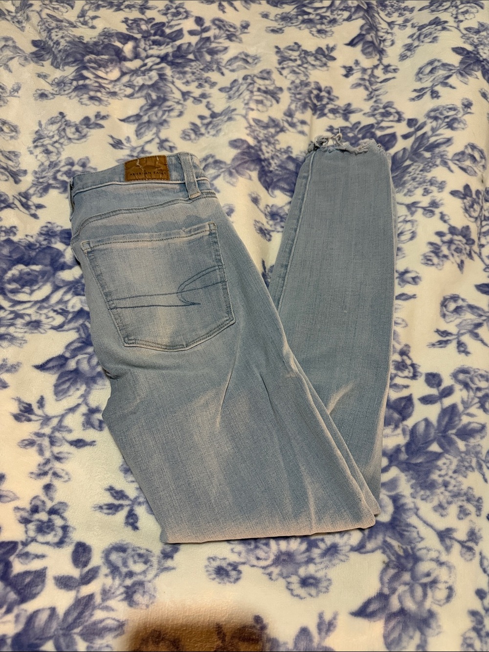 American Eagle Outfitters Light Blue Skinny Jeans with Raw Hem